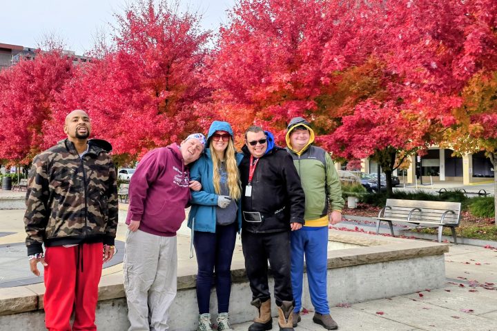 a group of five standing by trees